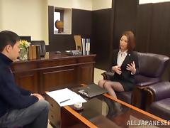 Japanese babe in a thong giving her guy handjob in the office