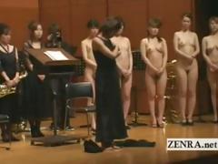 Japanese gals line up for the orchestra for a strip show