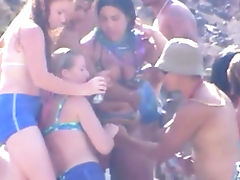 Bikini wearing temptresses going crazy on the beach