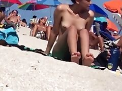 Beautiful Latina showing her pussy on nude beach