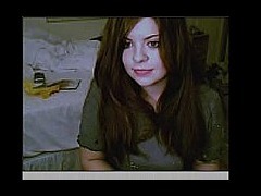 Very young teen posing in front of her webcam