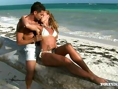 Kathy Campbel gives a terrific blowjob on the shore of a sea