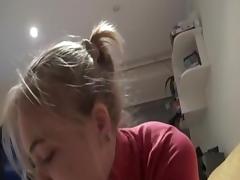 Golden-Haired angel is sucking on a hard strapon