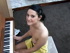 Awesome babe Elise is playing on piano